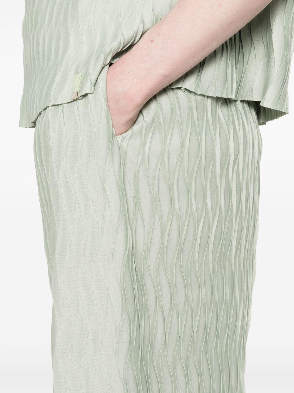 Pantaloni con effetto stropicciato PT000118D52102 7109 VERDE CHIARO HERNO