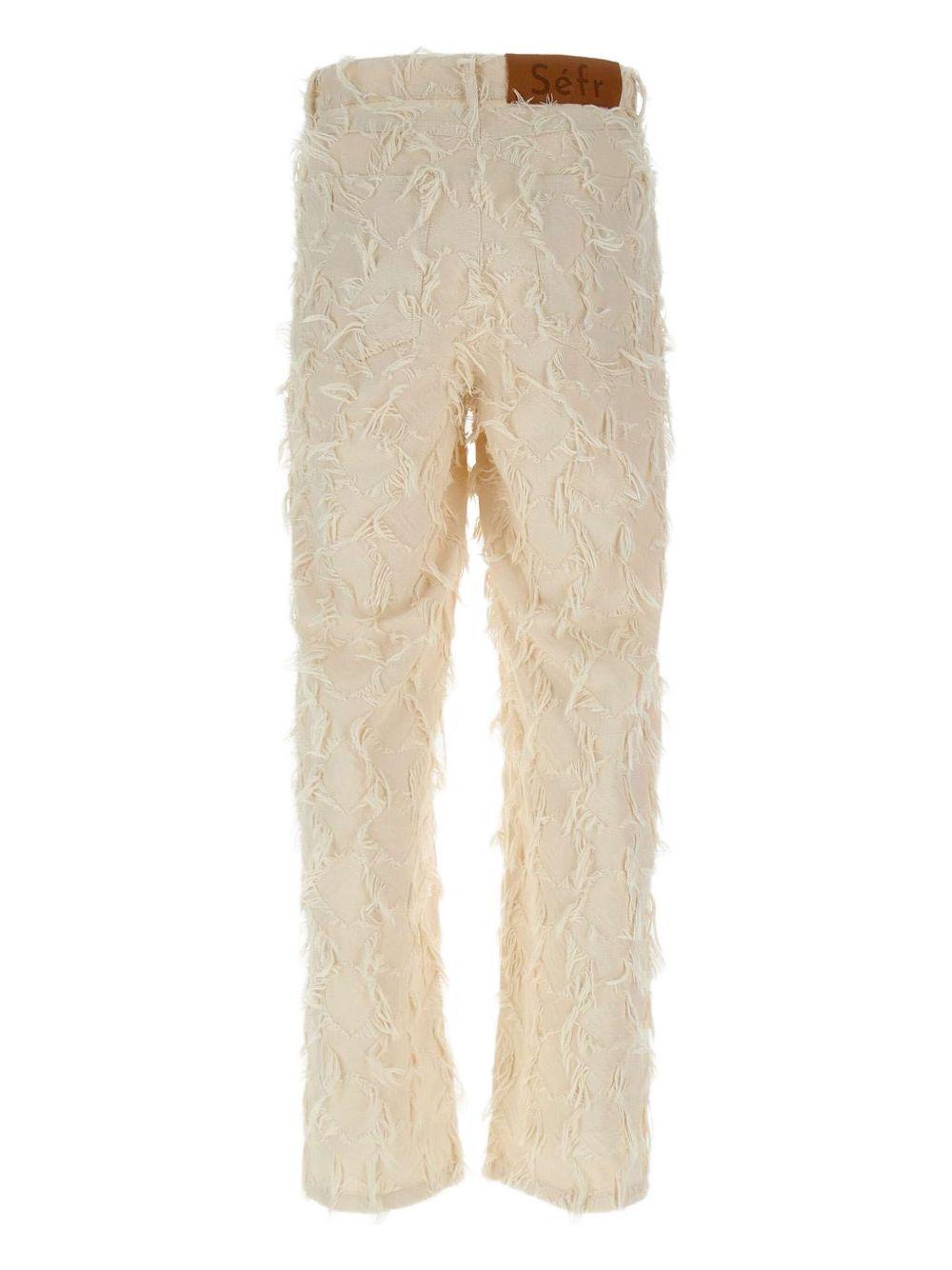 Jeans con frange all-over Nikos MSS25NIKOSF WHITE Séfr