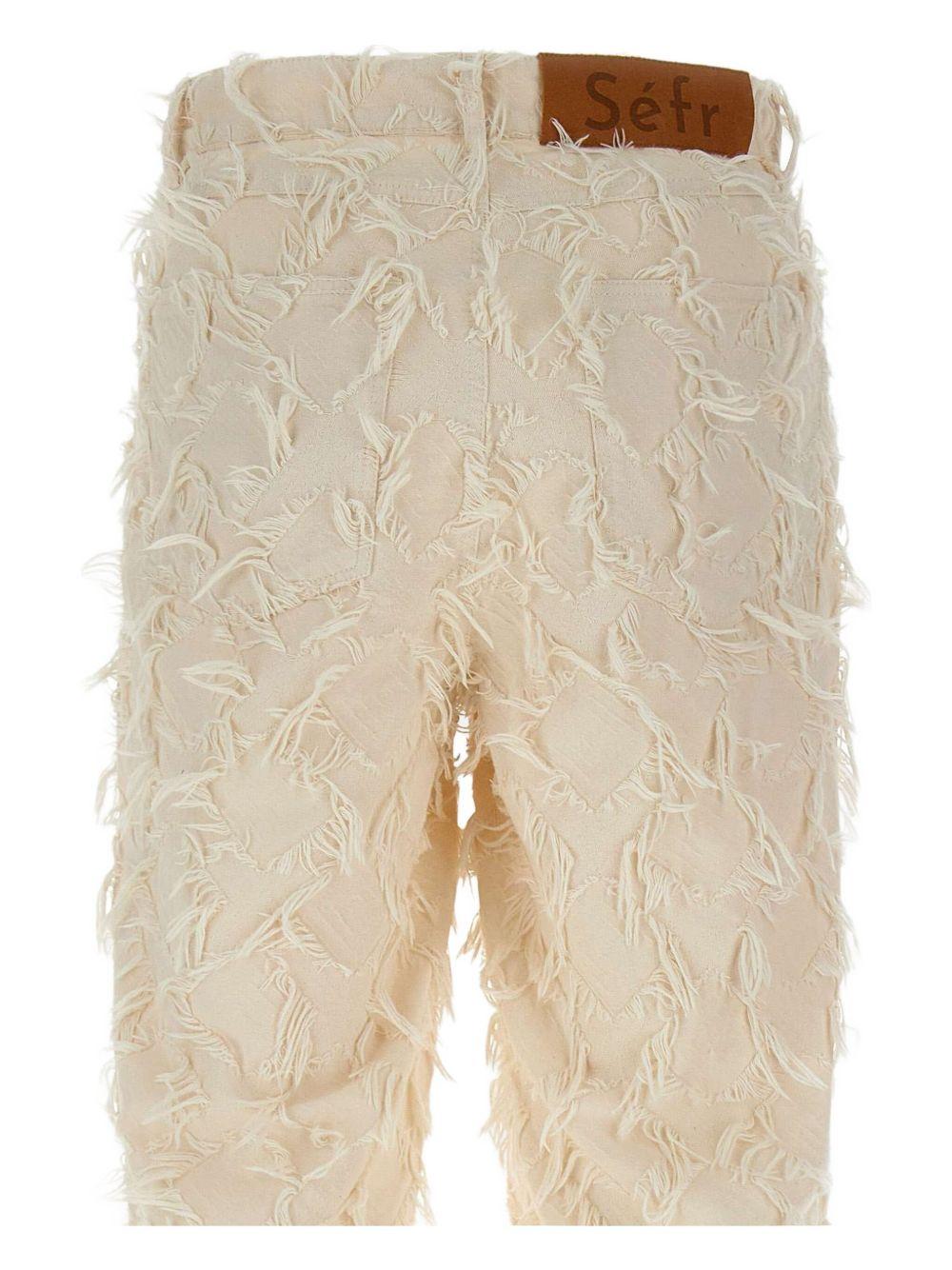 Jeans con frange all-over Nikos MSS25NIKOSF WHITE Séfr 