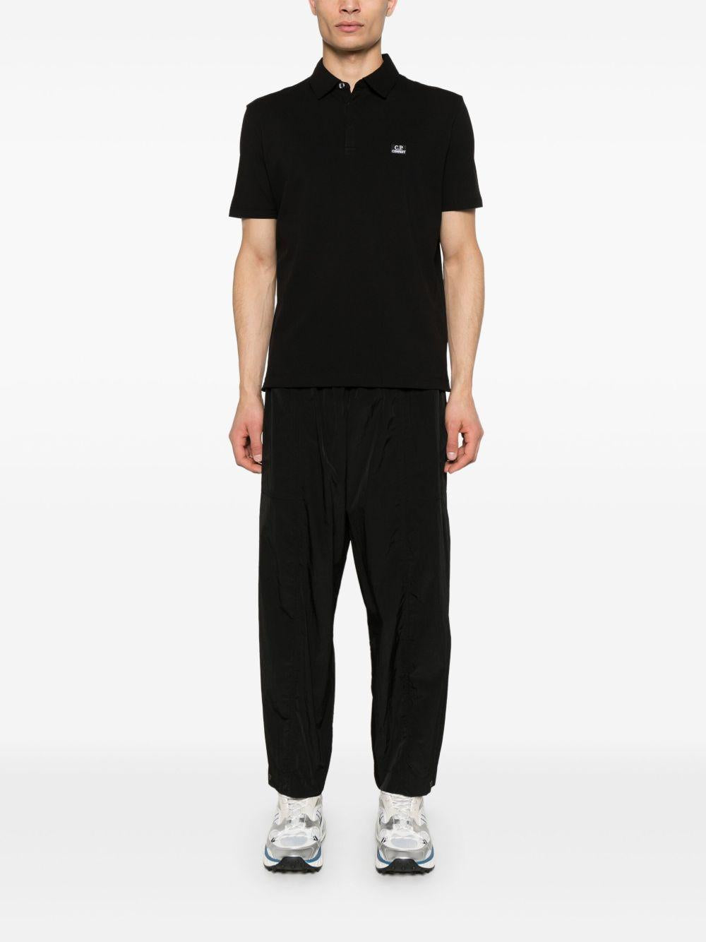 Strech Piquet Three-button Logo Polo 18CMPL165A005263W 999 BLACK CP COMPANY 